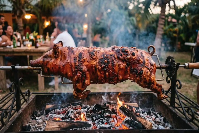 Whole pig and cow slow-roasted over open flame
